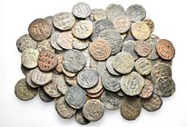 A lot containing 81 bronze coins. All: Islamic. Fine to very fine. LOT SOLD AS IS, NO RETURNS. 81 coins in lot.