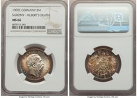 Saxony. Georg 2 Mark 1902-E MS66 NGC, Muldenhutten mint, KM1255. The obverse is adorned from 6 o' clock to 11 o' clock with light gold tones that tran...