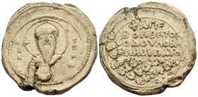 Basileios Hypatos, 11th century. Seal or Bulla (Lead, 31 mm, 24.90 g, 12 h), Overstruck on a seal of a certain Nikolaos. O B/A-C/H/Λ Facing, nimbate a...