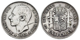 Alfonso XII (1874-1885). 1 pesetas. 1885*18-85. Madrid. MSM. (Cal-61). Ag. 4,94 g. Raya en anverso. Almost VF. Est...35,00.