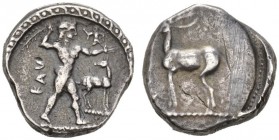CLASSICAL COINS 
 BRUTTIUM 
 CAULONIA 
 Nomos, about 510-485 BC. AR 7.99 g. KAV Apollo, nude, advancing r. on dotted line, holding laurel branch in...