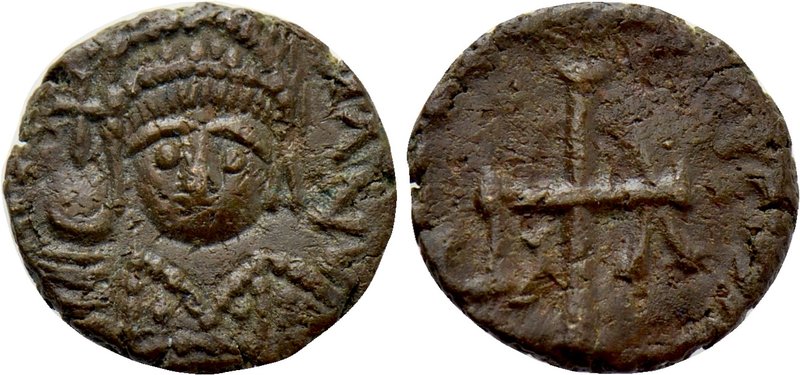 JUSTINIAN I (527-565). Nummus. Rome. 

Obv: Helmeted and draped facing bust.
...