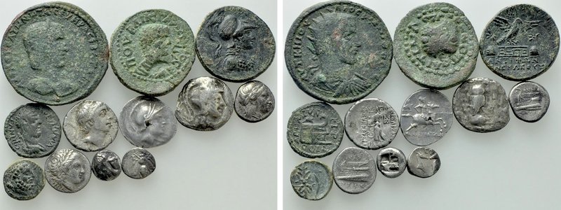 12 Greek and Roman Provincial Coins. 

Obv: .
Rev: .

. 

Condition: See ...