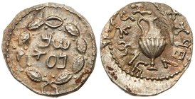 Judaea, Bar Kokhba Revolt. Silver Zuz (3.37 g), 132-135 CE. Undated, attributed to year 3 (134/5 CE). 'Simna' (Paleo-Hebrew) within wreath of thin bra...
