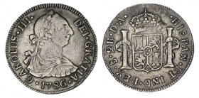 2 REALES. Santiago. 1786-DA. XC-1429. 6,47 g. Bonita pát. Leve fallo de metal en rev. RARA. MBC
