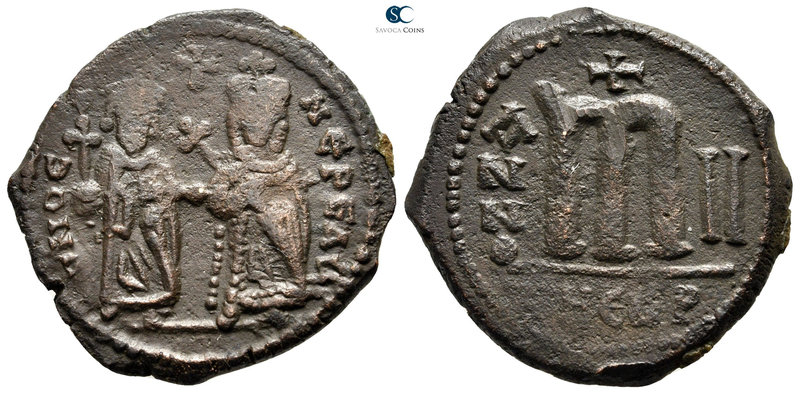Phocas, with Leontia AD 602-610. Theoupolis (Antioch)
Follis Æ

28 mm., 9,77 ...