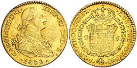1802. Carlos IV. Sevilla. CN. 2 escudos. (Cal. 454). 6,78 g. Rayitas. Bella. Brillo original. Ex Colección de 2 reales y 2 escudos, Áureo 09/04/2003, ...