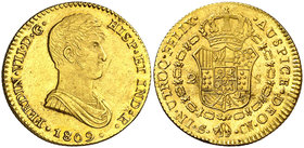 1809. Fernando VII. Sevilla. CN. 2 escudos. (Cal. 256). 6,66 g. Busto acorazado. Dos insignificantes hojitas. Muy bella. Brillo original. Rara y más a...