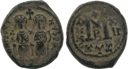 Justin II, with Sophia. 565-578. Ae follis
Cyzicus mint.
Justin, holding globus cruciger, and Sophia, holding cruciform scepter, seated facing on doub...