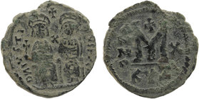 JUSTIN II (565-578). Follis. Kyzikos.
Justin, holding globus cruciger, and Sophia, holding cruciform sceptre, seated facing on double throne, both cro...