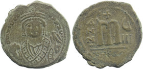 Maurice Tiberius AE Follis Antioch 582-602 AD.
blundered legend, bust facing, wearing crown with trefoil ornament, and consular robes; in right hand, ...