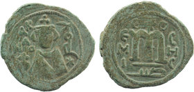 Umayyads, Arab-Byzantine Anonymous .
Abd al-Malik, 65-86 H./685-705 AD Follis 
Obv: Imperial bust facing, to right the mint name in Arabic downwards a...