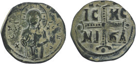 Anonymous (attributed to Michael IV). Ca. 1034-1041. AE Follis
Three-quarter length figure of Christ standing facing, wearing nimbus crown, pallium, a...