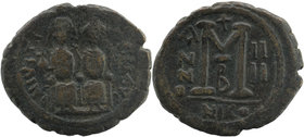 Justin II. 565-578. AE follis. Nicomedia mint
Justin on left, Sophia on right, seated facing on double-throne, both nimbate, Justin holding globus cru...