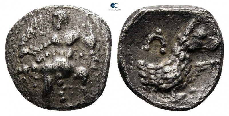 Lycaonia. Laranda 324-323 BC. 
Obol AR

10mm., 0,74g.

Baaltars seated left...