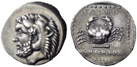 Greek Coins   Islands off Caria, Cos  Tetradrachm circa 355-5, AR 15.07 g. Bearded head of Heracles l., wearing lion’s skin headdress. Rev. KΩION Crab...