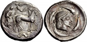 Greek Coinage 
 Syracuse 
 Tetradrachm circa 470-466, AR 17.51 g. Slow quadriga driven r. by charioteer holding reins and kentron ; above, Nike flyi...
