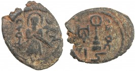 ARAB-BYZANTINE: Standing Caliph, ca. 692-697, AE fals (2.61g), Harran, A-3537, unusual type, unique to this mint, nice strike on crude planchet, VF, R...