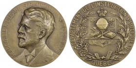 CANADA: AE medal, 1924, 50mm, bronze medal by Joseph Brulieau, HON. CYRILLE F. DELAGE, SURINTdt DE L'INSTRon PUBLIQUE around bust of Delage // DEPARTM...