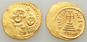 Heraclius (AD 610-641), with Heraclius Constantine. AV solidus (22mm, 4.62 gm, 7h). AU, flat strike. Constantinople, 5th officina, ca. AD 616-625. dd ...