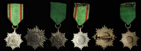 GERMANY. Trio of Different Ostvolk Insignia (3 Pieces), Instituted 1942. Average Grade: EXTREMELY FINE.
Includes a First Class pin with swords, Barac...