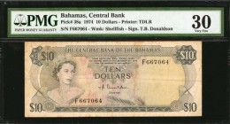 BAHAMAS. Central Bank of the Bahamas. 10 Dollars, 1974. P-38a. PMG Very Fine 30.
Printed by TDLR. Watermark of shellfish. Signature of T.B. Donaldson...