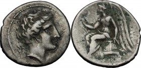 Greek Italy. Bruttium, Terina. AR Drachm, circa 300 BC. D/ Head of the nymph Terina right; triskeles behind neck. R/ Nike seated left on plinth, holdi...