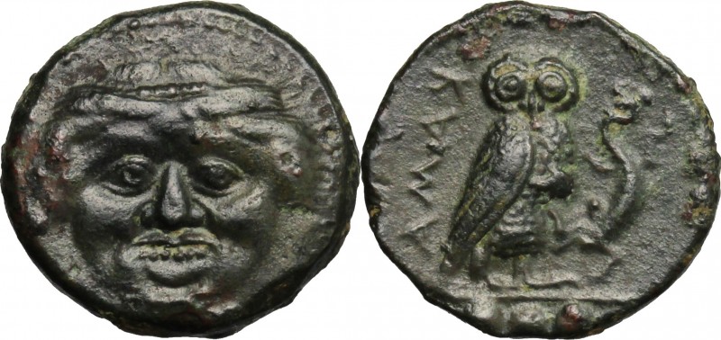 Sicily. Kamarina. AE Tetras, 425-405 BC. D/ Gorgoneion. R/ Owl standing right, h...
