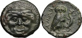 Sicily. Kamarina. AE Tetras, 425-405 BC. D/ Gorgoneion. R/ Owl standing right, head facing, holding lizard; in exergue, three pellets. CNS III, 21. AE...