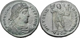 Jovian (363-364). AE 27 mm, Thessalonica mint, 363-364. D/ Bust, right, diademed, draped, cuirassed. R/ Emperor standing right, holding labarum and Vi...
