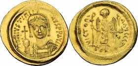 Justinian I (527-565). AV Solidus, Constantinople mint. Struck 519-527. D/ Helmeted and cuirassed bust facing, holding globus cruciger and shield deco...