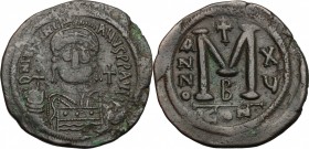 Justinian I (527-565). AE Follis, Constantinople mint, 541-542. D/ Bust facing, helmeted, cuirassed, holding globus cruciger. R/ Large M (mark of valu...