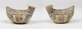 Daunian pottery askos.
 Duck-shaped, with red and dark brown decoration.
 Circa 4th cent. BC.
 13 cm length, 8.5 cm height.
 Intact.