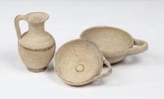 Lot of 3 Greek vessels: 1 lekythos and 2 cups.
 4th century BC.
 12 cm, 13 cm, 11 cm.