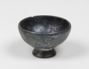 Greek black-glazed miniature cup.
 4th century BC.
 6.7 cm diameter; 4 cm height.