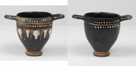 Gnathia-Ware Skyphos.
 The body decorated with vine and ivy tendrils.
 Apulia, 4th century BC.
 H. 9.7 cm.