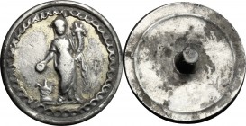 Silver (gilded) Phalera with image of Concordia standing facing, holding patera over altar and cornucopiae.
 Roman period, 1st-3rd century.
 18 mm.