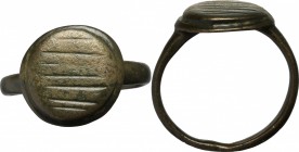 Bronze ring, the bezel decorated with lines.
 Middle ages.
 Size 16.7 mm.