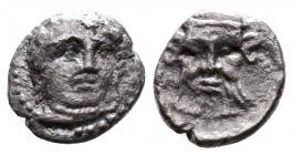 CILICIA, Uncertain. Circa 400-350 BC. AR Obol. Turreted and bearded head left / Bearded facing head surmounting facing head of lion. SNG Levante -; SN...