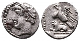 CILICIA, Uncertain. 4th century BC. AR Obol. Head left, wearing wreath of grain ears / Eagle, with spread wings, standing left on the back of lion rec...