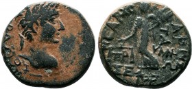 Augustus - Phrygia AE of Prymnessus (27 BC-14 AD), Dikaiosyne, scales Obv: Laureate head right. Legend: ΣΕΒΑΣΤΟΣ Rev: Dikaiosyne advancing, left, with...