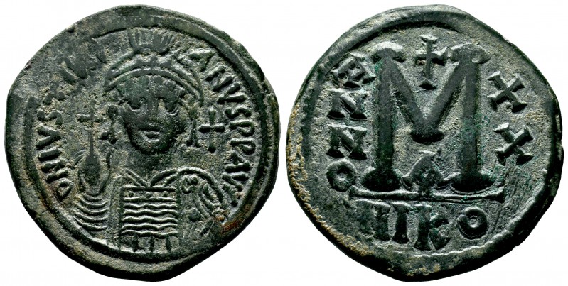 Justinian I the Great (AD 527-565). AE follis. Constantinople, RY 20. Helmeted a...