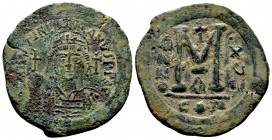 Justinian I the Great (AD 527-565). AE follis . Constantinople, RY 15. Helmeted and cuirassed bust of Justinian facing, holding globus cruciger and sh...