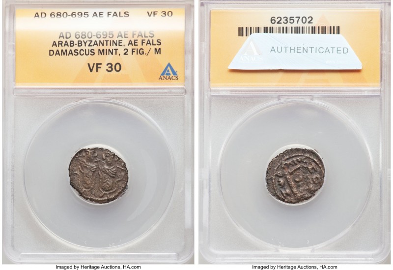 ARAB-BYZANTINE. Umayyed Dynasty. Late AD 7th century. AE fals (17mm, 5h). ANACS ...