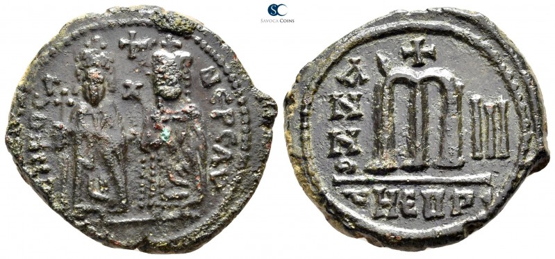 Phocas, with Leontia AD 602-610. Theoupolis (Antioch)
Follis Æ

29 mm., 10,74...