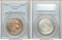 Prussia. Friedrich Wilhelm III Taler 1823-A AU58 PCGS, Berlin mint, KM413. Deep peachy tones engulf the obverse while the reverse remains mostly brigh...