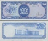 Trinidad & Tobago: 100 Dollars L.1964 with signature: V. E. Bruce, P.35a, very nice with bright colors, just a few vertical folds. Condition: VF/VF+
...