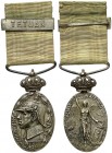 (1916). Marruecos. Medalla. (Pérez Guerra 817c). 19 g. 38x28 mm. Metal blanco. Escudo de Melilla en reverso. Con corona, cinta y pasador con tetuán in...