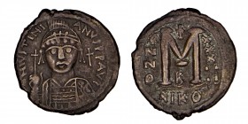 Justinian I Æ 40 Nummi. Nicomedia, year 29, AD 555/
6. Helmeted and cuirassed facing bust, holding globus cruciger and shield; cross to right / Large ...