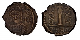 Justinian I, Theoupolis, AD, (527-565)
Decanummium Æ, [DN IV] STINIANVS PP AVG, helmeted and cut bust front, cross holding on sphere and armor, diagon...